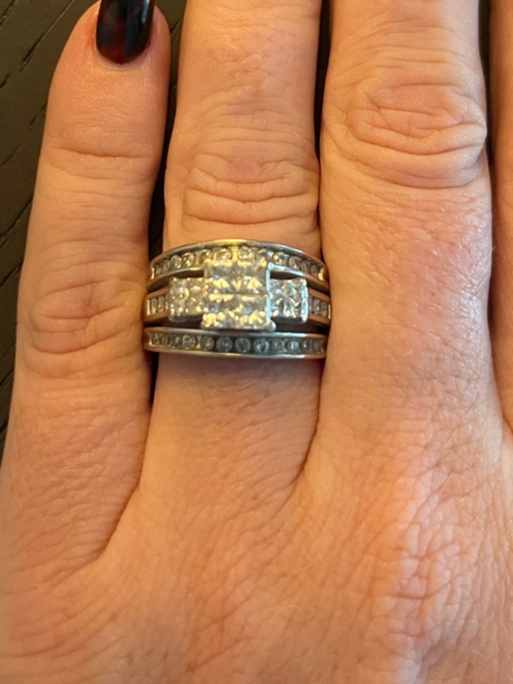 Woman’s wedding ring and bands